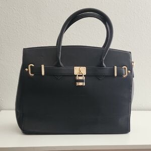 Elegant Black Leather Handbag with Gold Color Lock. NEVER USED.